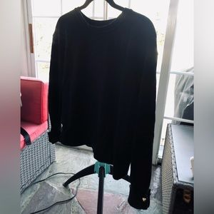 Black pullover with silver ball sleeve detail